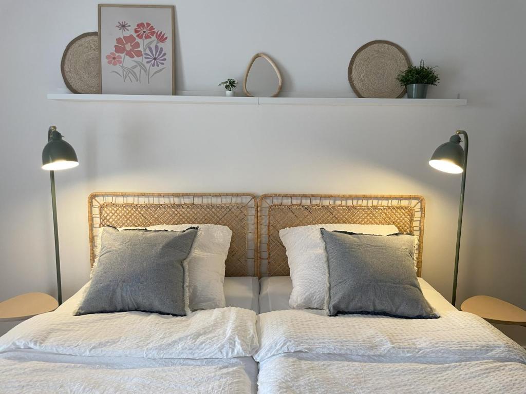 a bedroom with a bed with two pillows at Haus Ludwig in Bad Schonborn