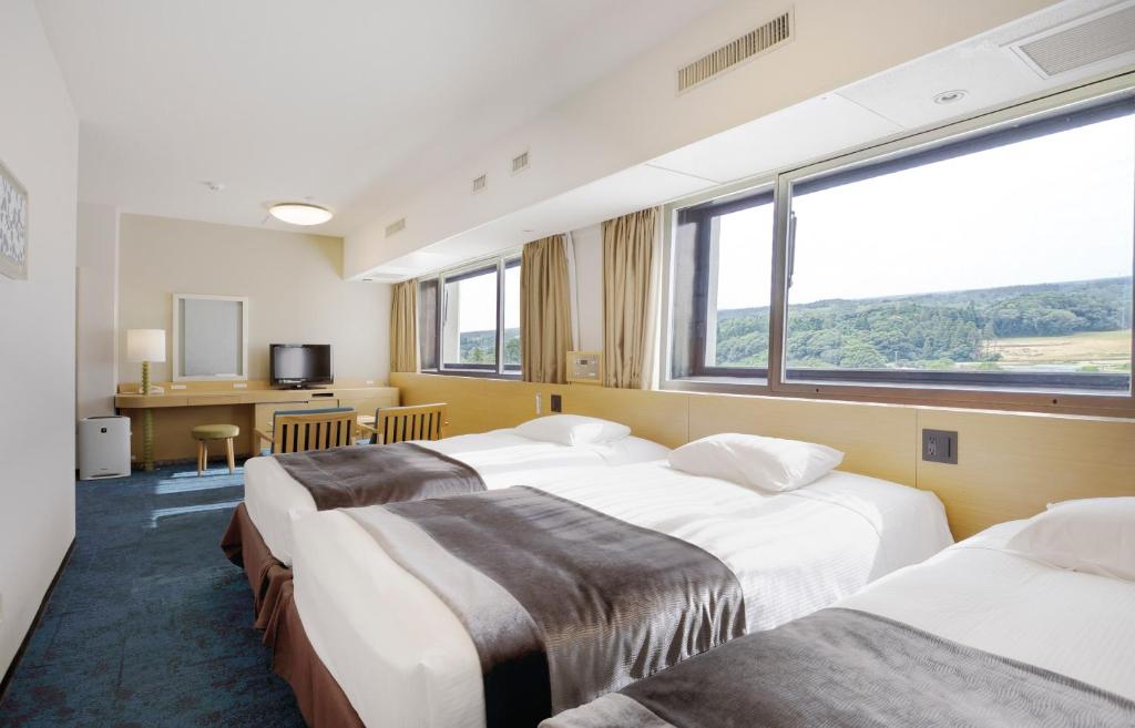 Postel nebo postele na pokoji v ubytování Art Hotel Narita