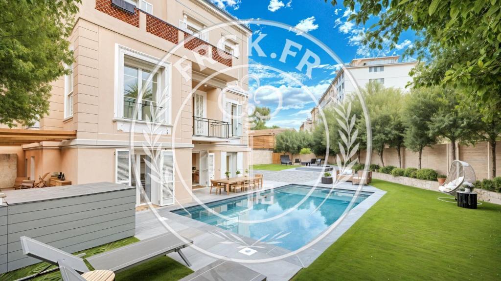 a house with a swimming pool in a yard at FRGK "VILLA La Cote D'Azur" in Cannes