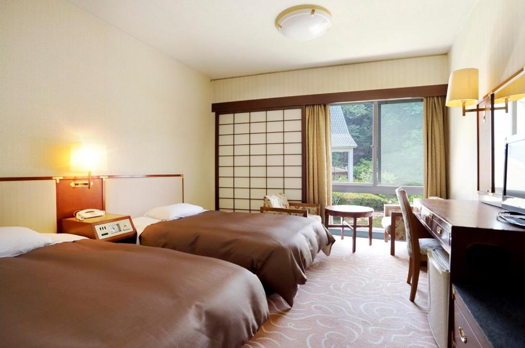 Postel nebo postele na pokoji v ubytování Art Hotel Narita