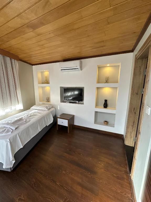 Postel nebo postele na pokoji v ubytování Gold Corner Hotel