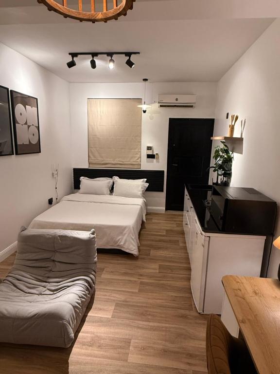 Postel nebo postele na pokoji v ubytování Iris by kisali