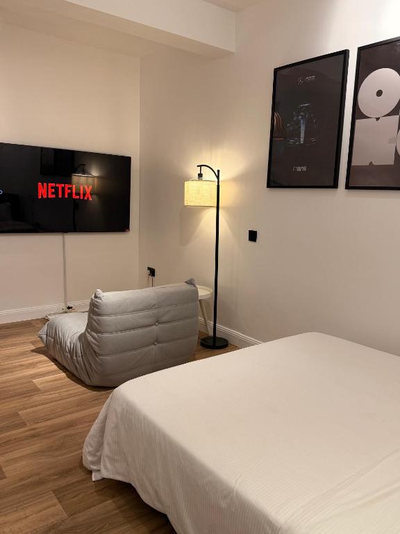 Postel nebo postele na pokoji v ubytování Iris by kisali
