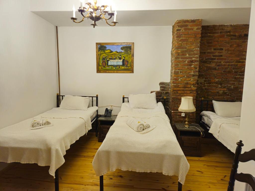 Postel nebo postele na pokoji v ubytování Boutique Hotel Verdzi