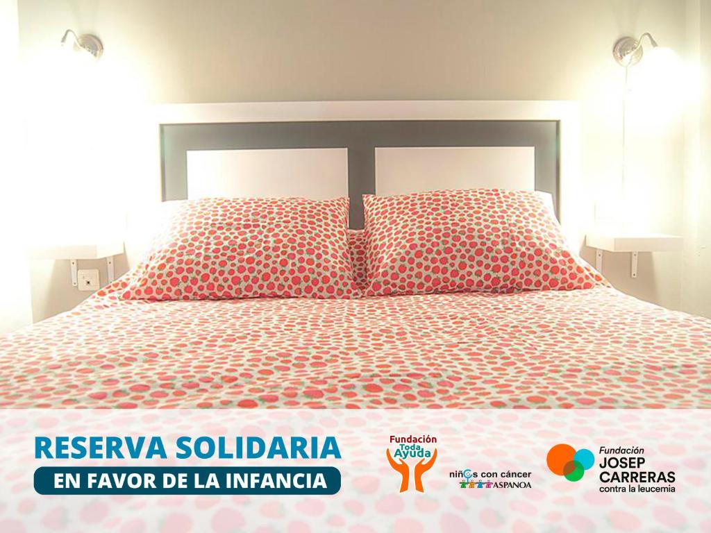 A bed or beds in a room at Apartamentos Catedral Plaza 3000
