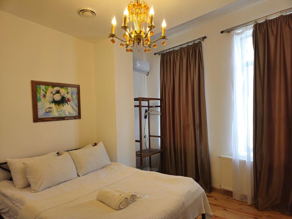 Postel nebo postele na pokoji v ubytování Boutique Hotel Verdzi