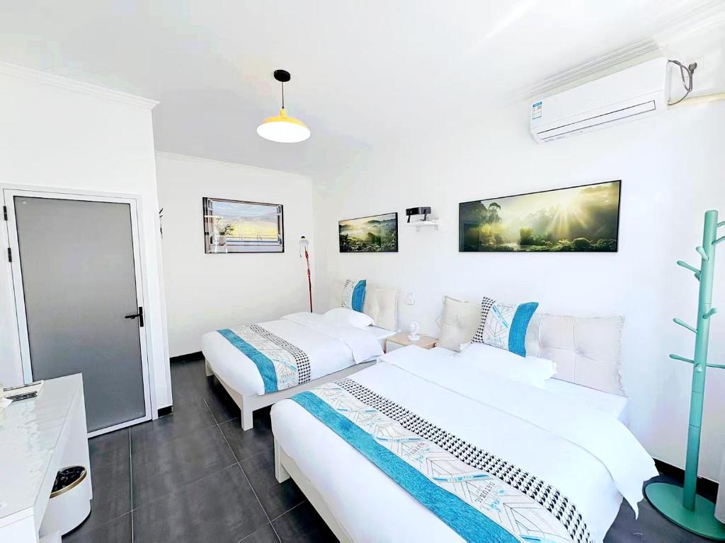 Postel nebo postele na pokoji v ubytování Beijing Great Wall Shiguang Homestay