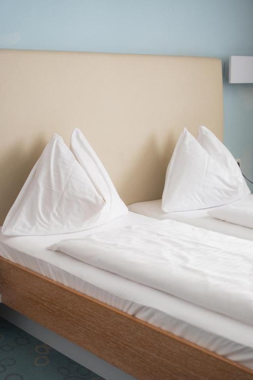Postel nebo postele na pokoji v ubytování Dom-Hotel