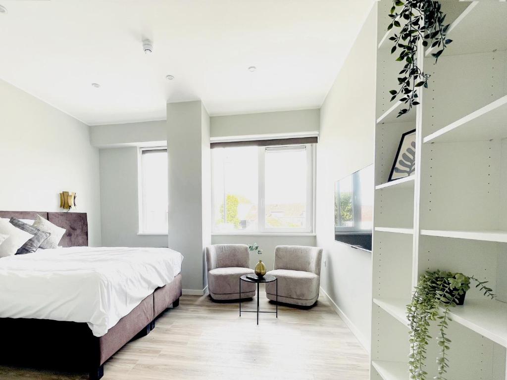 En eller flere senge i et værelse på Comfortable Room w Private Bathroom & Fast WiFi