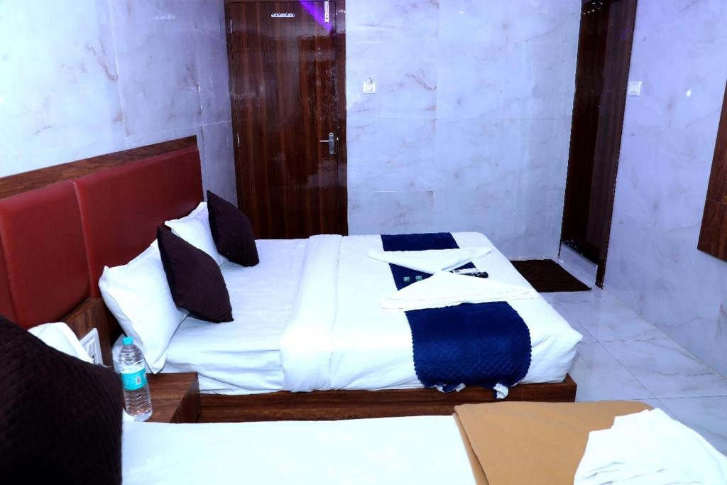 Katil atau katil-katil dalam bilik di Hotel Chirag Next