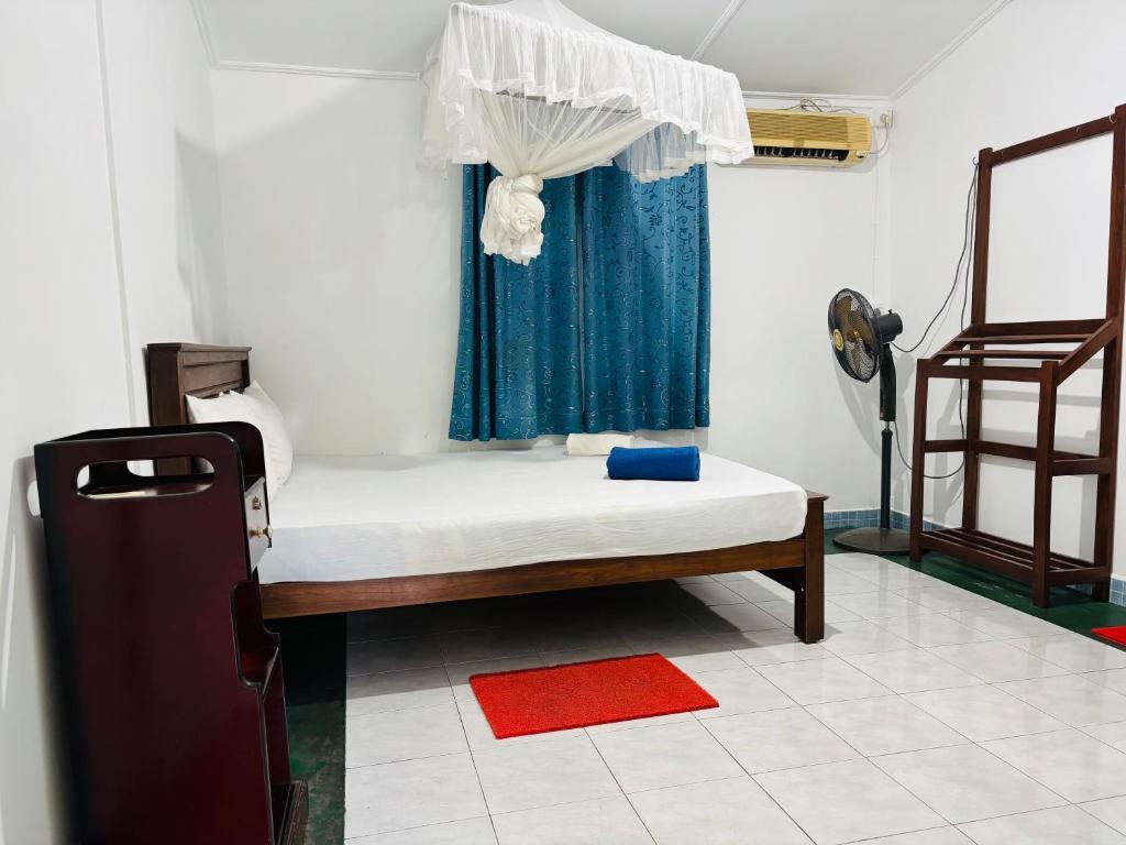 Postel nebo postele na pokoji v ubytování Levi's Tourist – Anuradhapura
