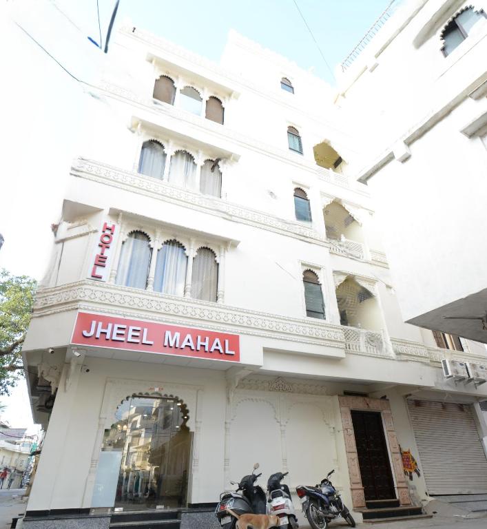 two motorcycles parked in front of a building at Hotel Jheel Mahal near City Palace in Udaipur