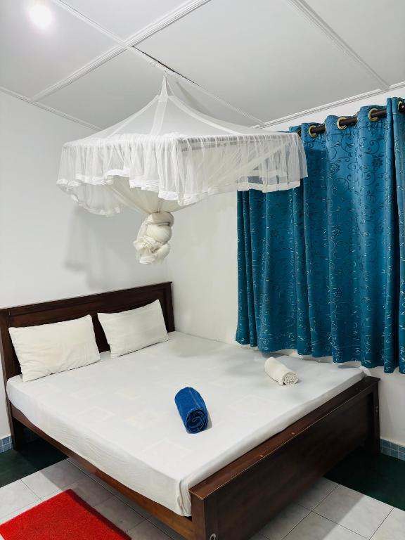 Postel nebo postele na pokoji v ubytování Levi's Tourist – Anuradhapura