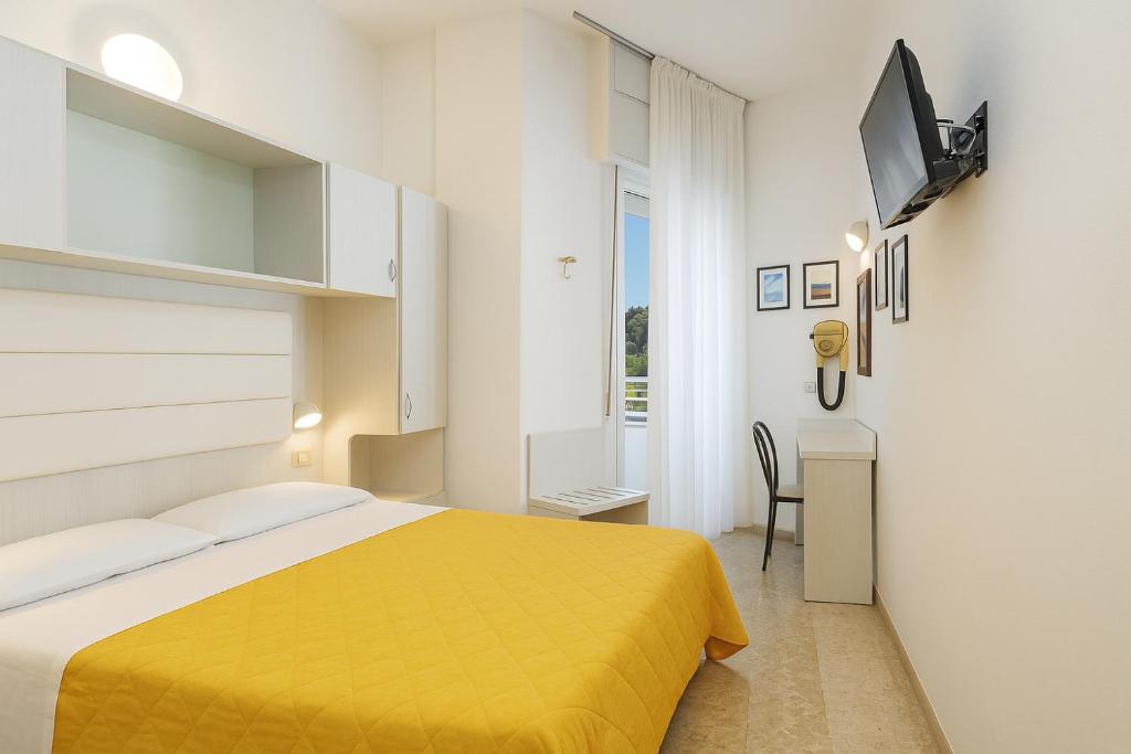 Postel nebo postele na pokoji v ubytování Hotel Imperiale