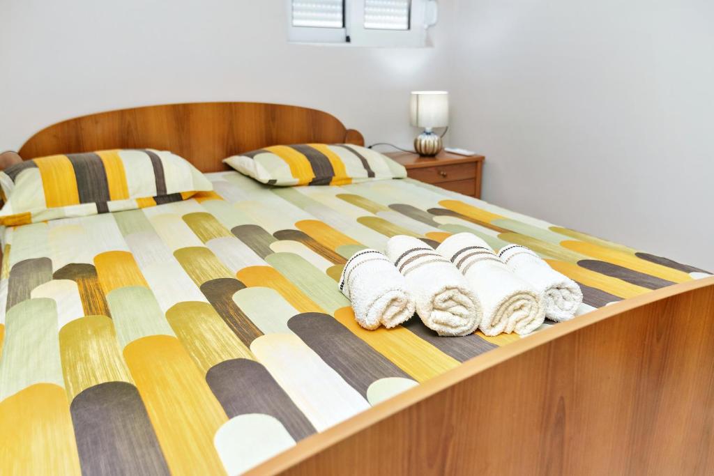 Postel nebo postele na pokoji v ubytování Apartments Posejdon