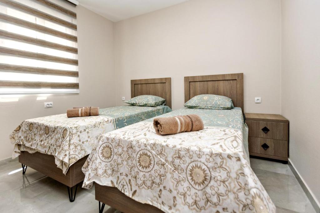 Postel nebo postele na pokoji v ubytování Apartments Posejdon