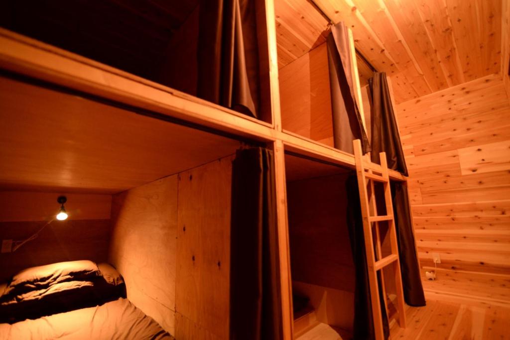 Postel nebo postele na pokoji v ubytování Hakone Guesthouse Toi