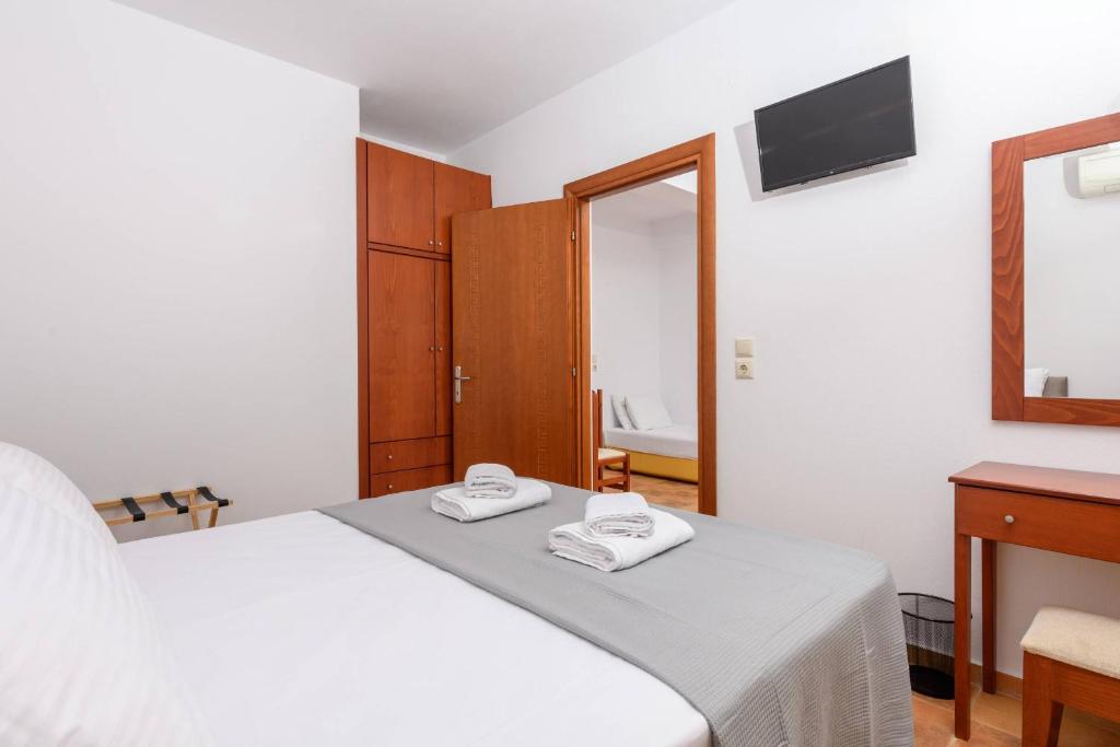 Postel nebo postele na pokoji v ubytování Villa Roxani