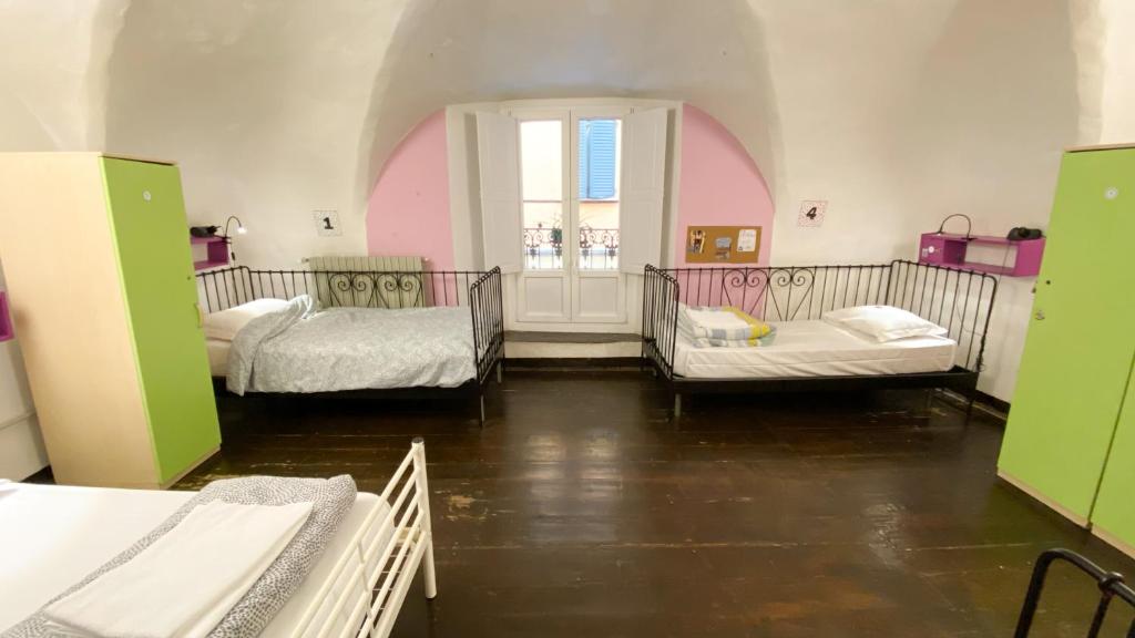 Postel nebo postele na pokoji v ubytování Hostel Il Nosadillo - Bologna