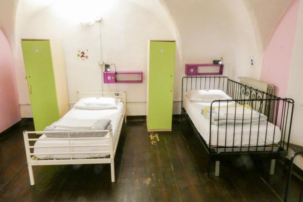Postel nebo postele na pokoji v ubytování Hostel Il Nosadillo - Bologna