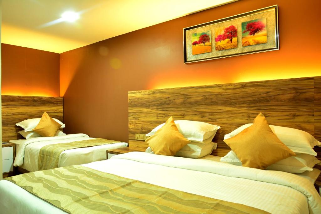 Postel nebo postele na pokoji v ubytování Pearl City Hotel