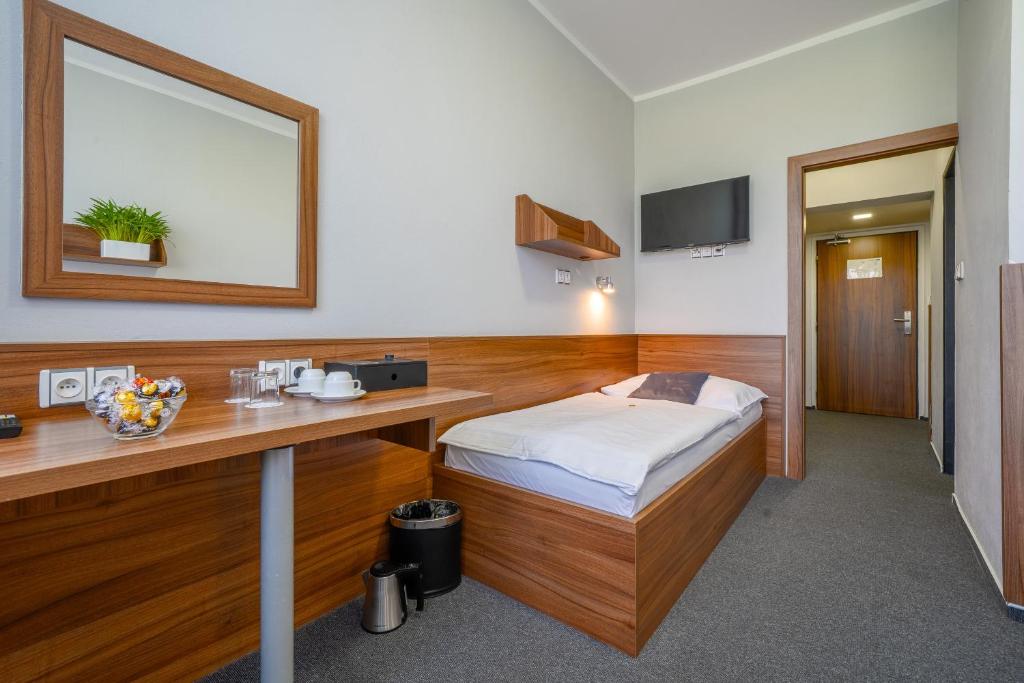 Postel nebo postele na pokoji v ubytování Hotel u Ledu