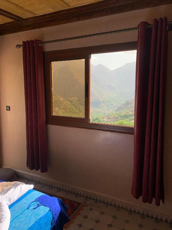 Postel nebo postele na pokoji v ubytování auberge atlas tamatertt