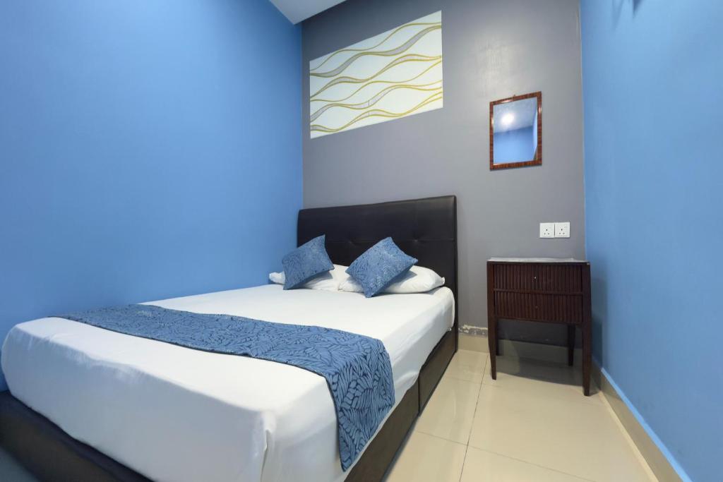 Postel nebo postele na pokoji v ubytování Hotel 3Winz, Chow Kit Hospital Kuala Lumpur