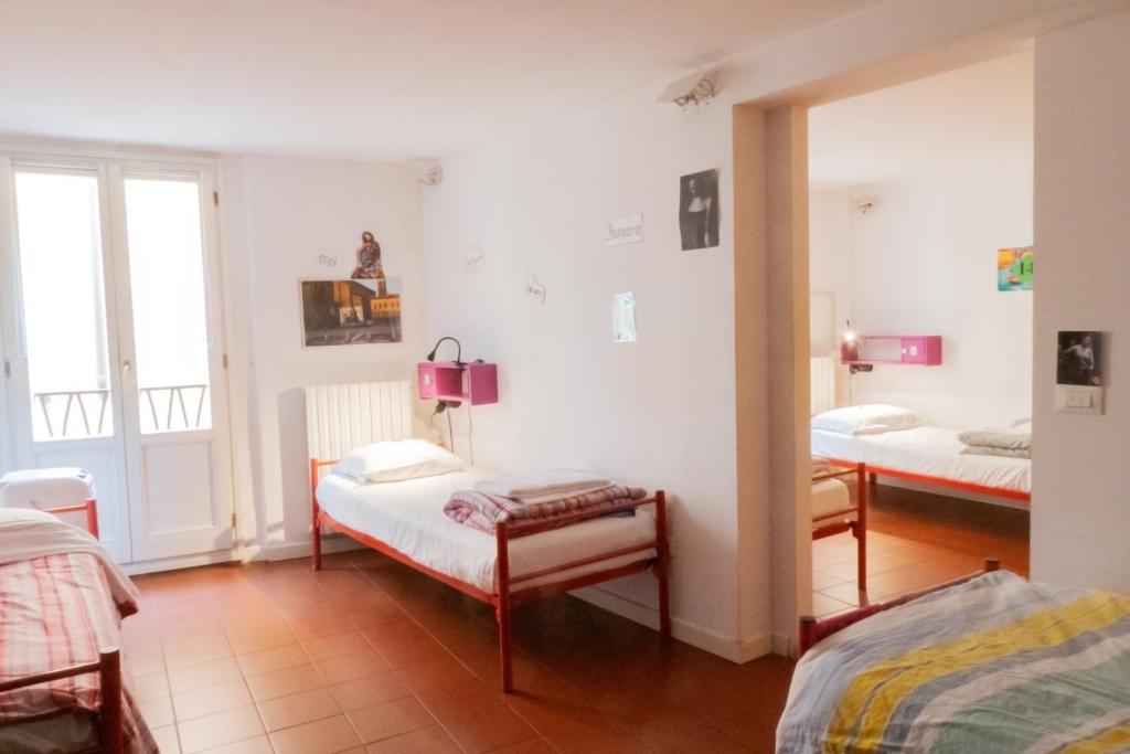 Postel nebo postele na pokoji v ubytování Hostel Il Nosadillo - Bologna