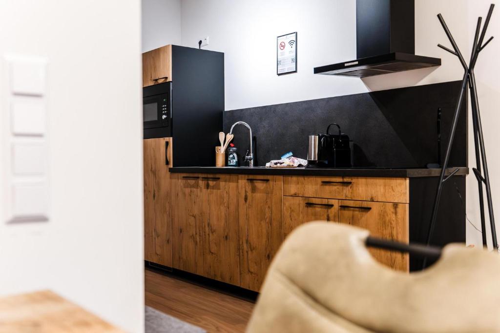 Kuchyň nebo kuchyňský kout v ubytování Clofers Relax Residences Rattendorf