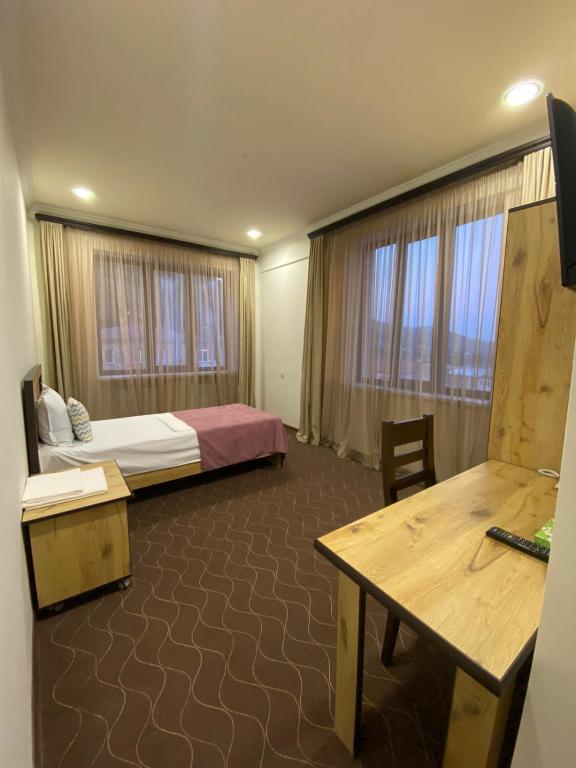 Postel nebo postele na pokoji v ubytování Mina Hotel