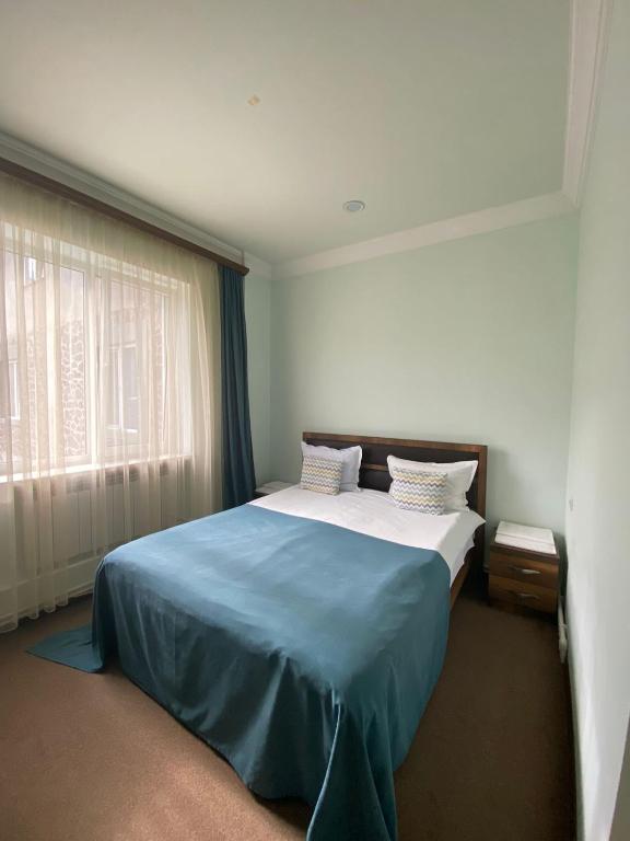 Postel nebo postele na pokoji v ubytování Mina Hotel