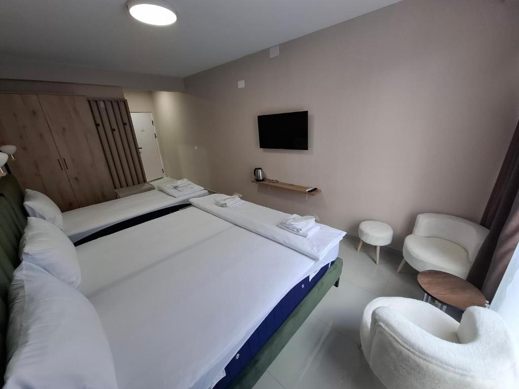 Postel nebo postele na pokoji v ubytování Hotel CENTRAL