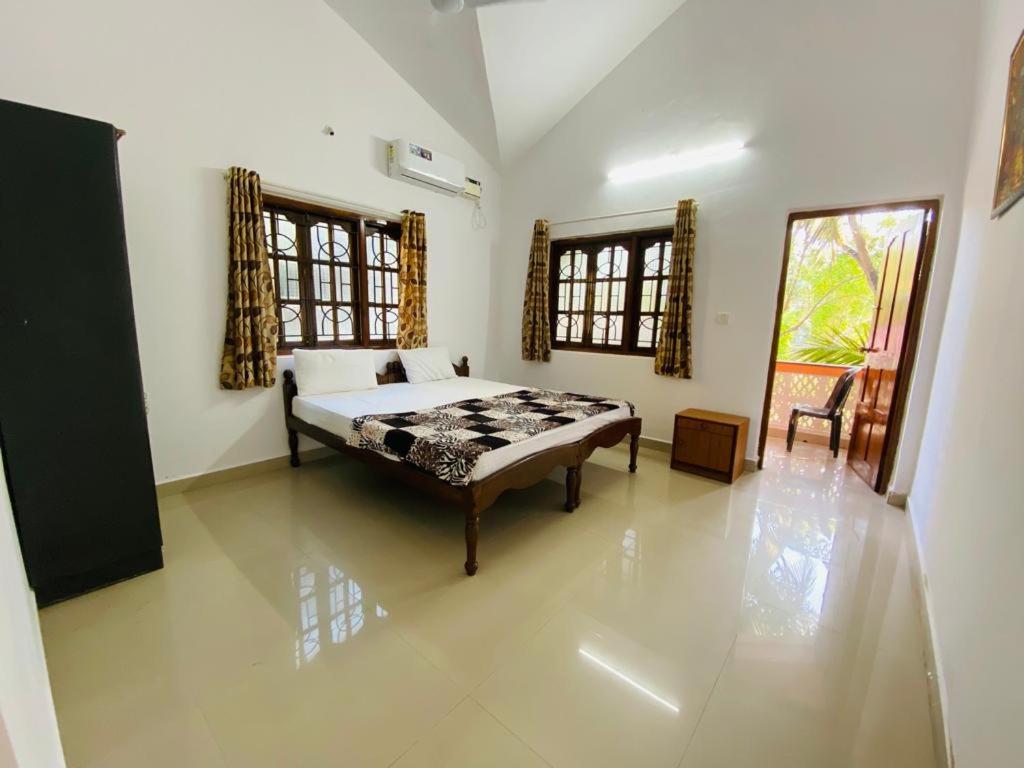 Ένα ή περισσότερα κρεβάτια σε δωμάτιο στο Tapas Villa 4Bhk