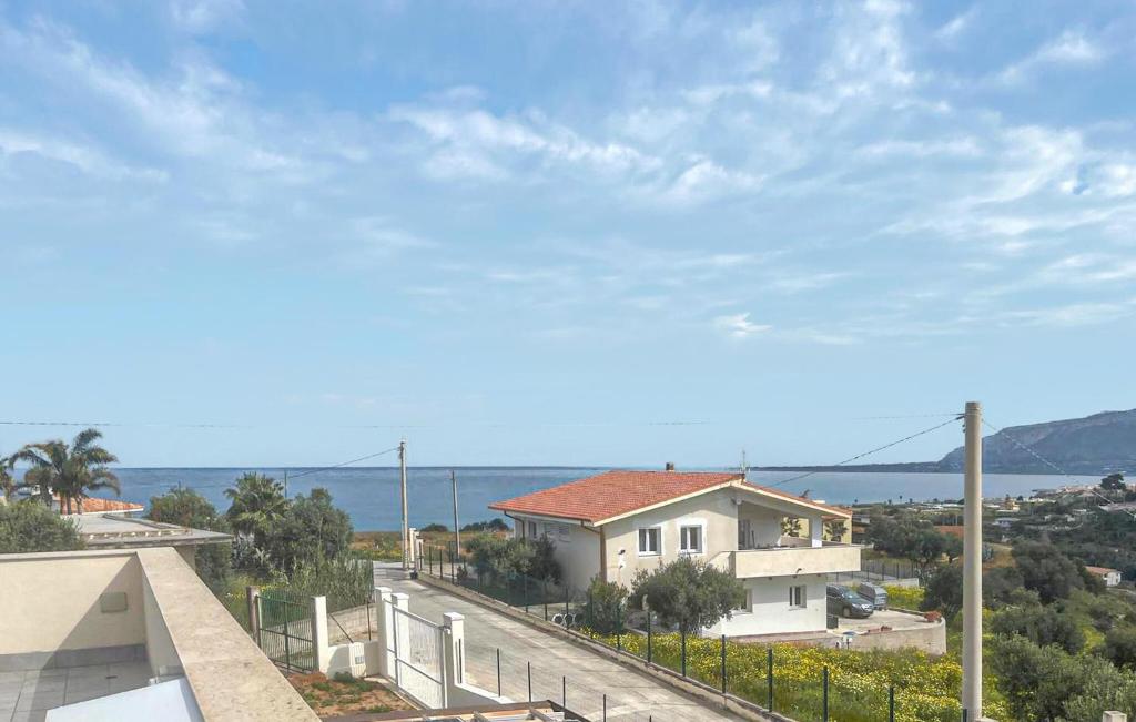 a view of a house with the ocean in the background at Cozy Home In Balestrate With Wifi in Balestrate