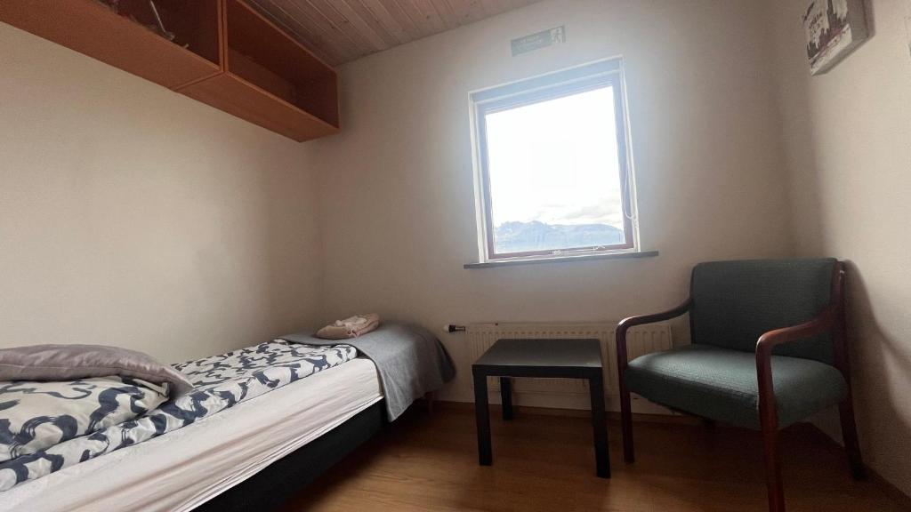 Una cama o camas en una habitación de Grund í Grundarfirði Economy Guesthouse