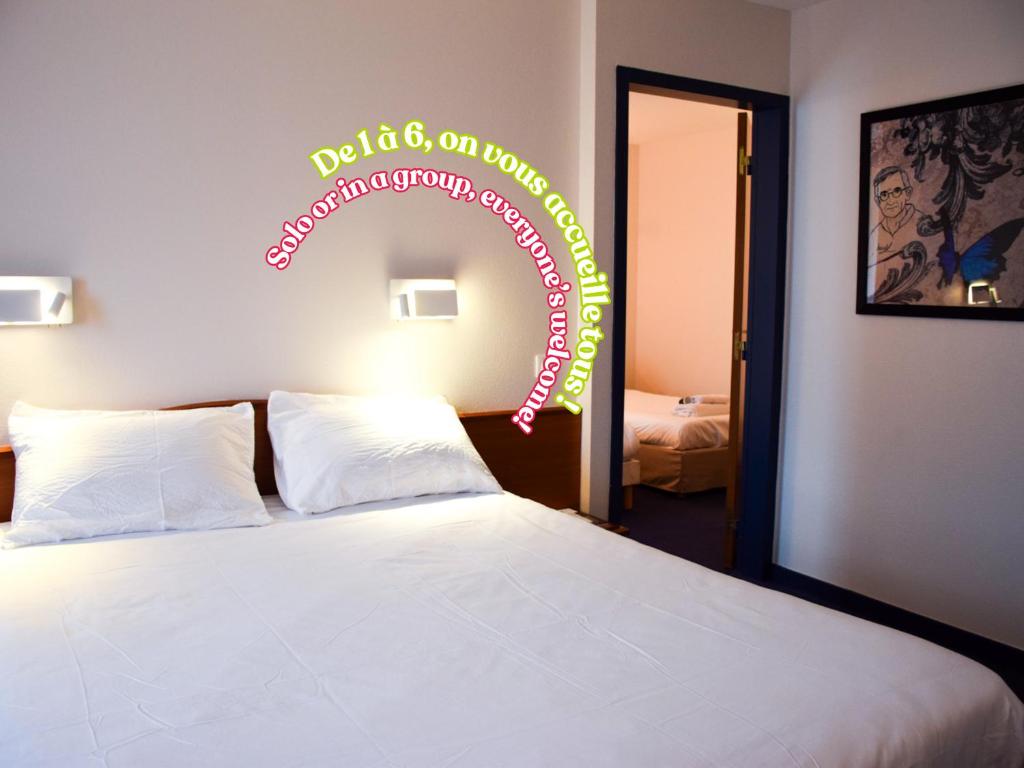 Postel nebo postele na pokoji v ubytování B&B HOTEL Rodez Bourran