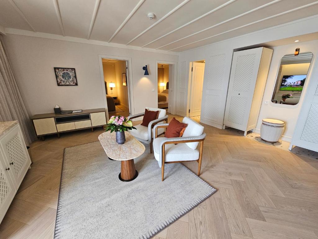 a living room with a couch and a table at Amadria Park Grand Hotel 4 Opatijska Cvijeta in Opatija