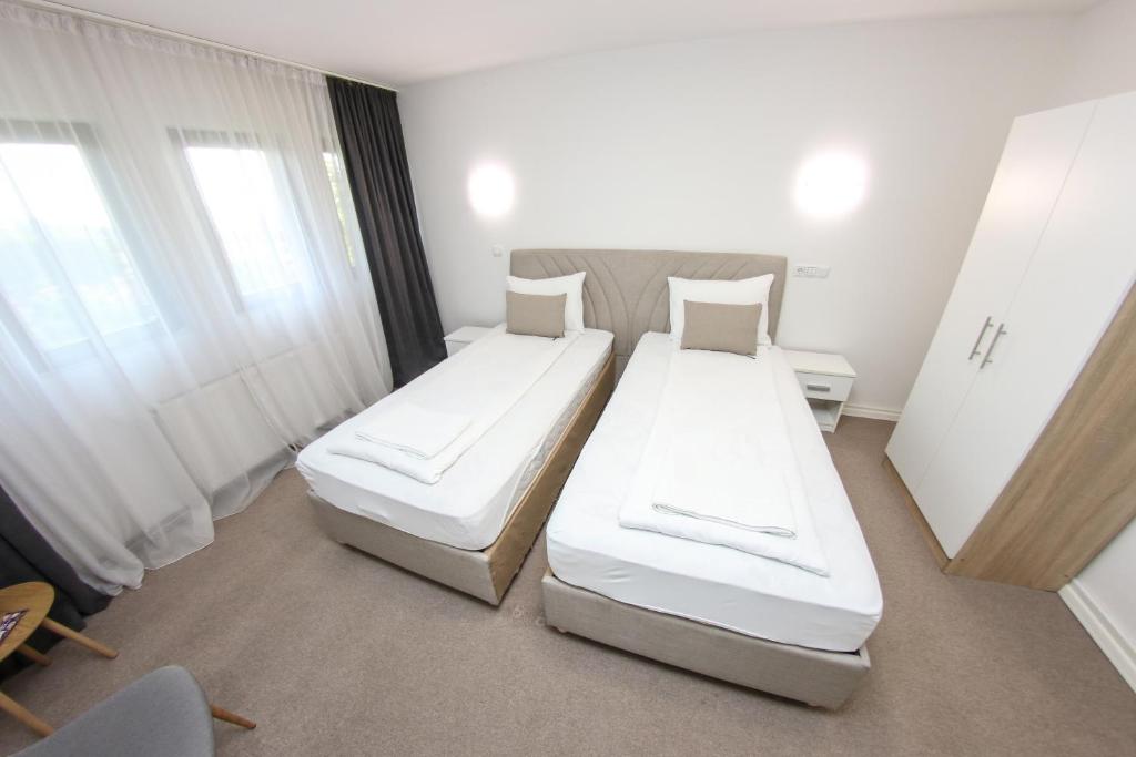 Łóżko lub łóżka w pokoju w obiekcie Guest House LIKE