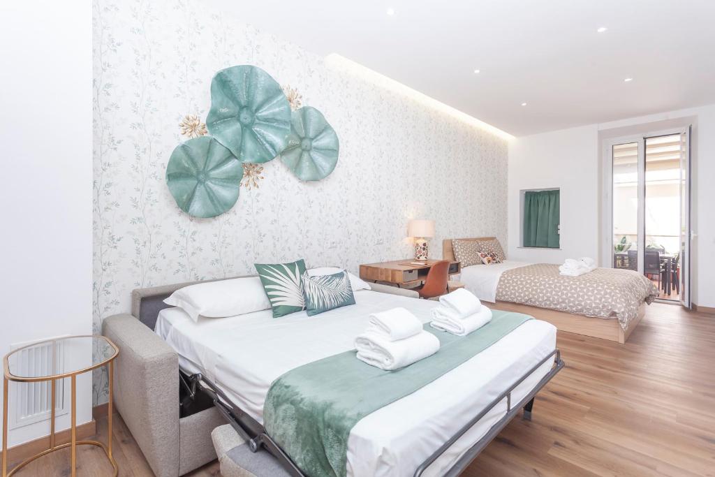 Postel nebo postele na pokoji v ubytování Vatican Vittoria Suites - Vatican museums