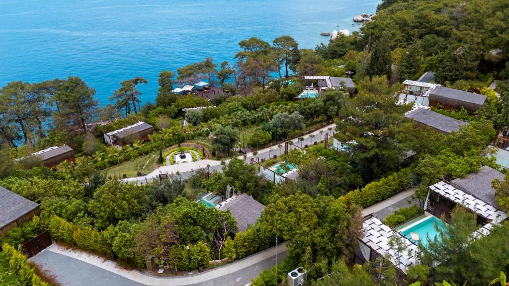 an aerial view of a mansion with the ocean at Lov Faralya Adults Only in Faralya