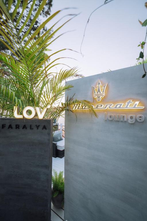 a sign for the entrance to a marriott hotel at Lov Faralya Adults Only in Faralya
