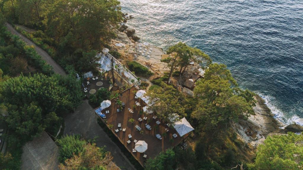 an aerial view of a resort near the ocean at Lov Faralya Adults Only in Faralya