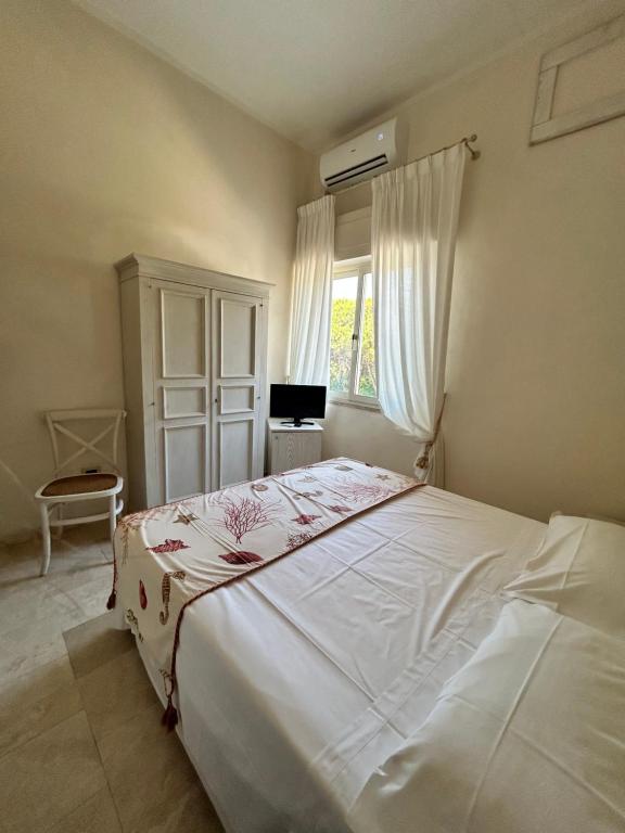 Postel nebo postele na pokoji v ubytování Hotel Bagni Lido