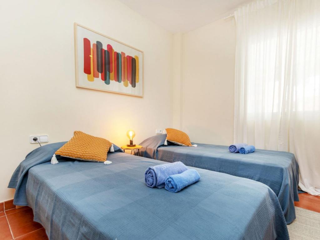 A bed or beds in a room at Apartment Green Mar H by Interhome