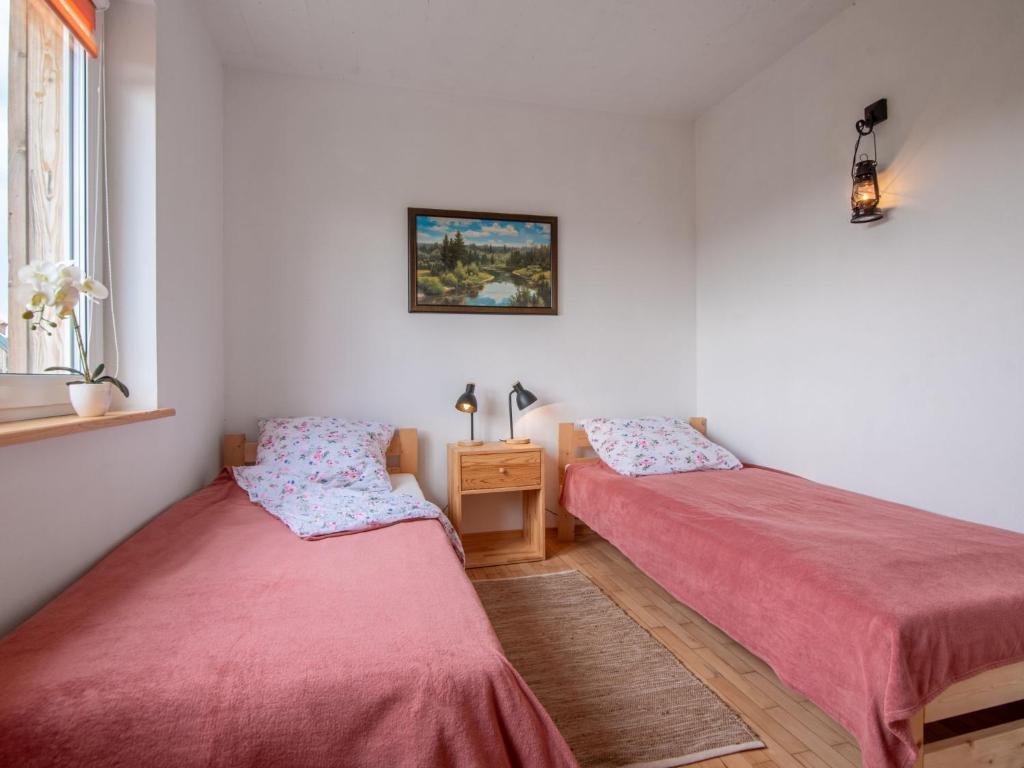 Łóżko lub łóżka w pokoju w obiekcie Holiday Home Zagroda nad Krutynią by Interhome