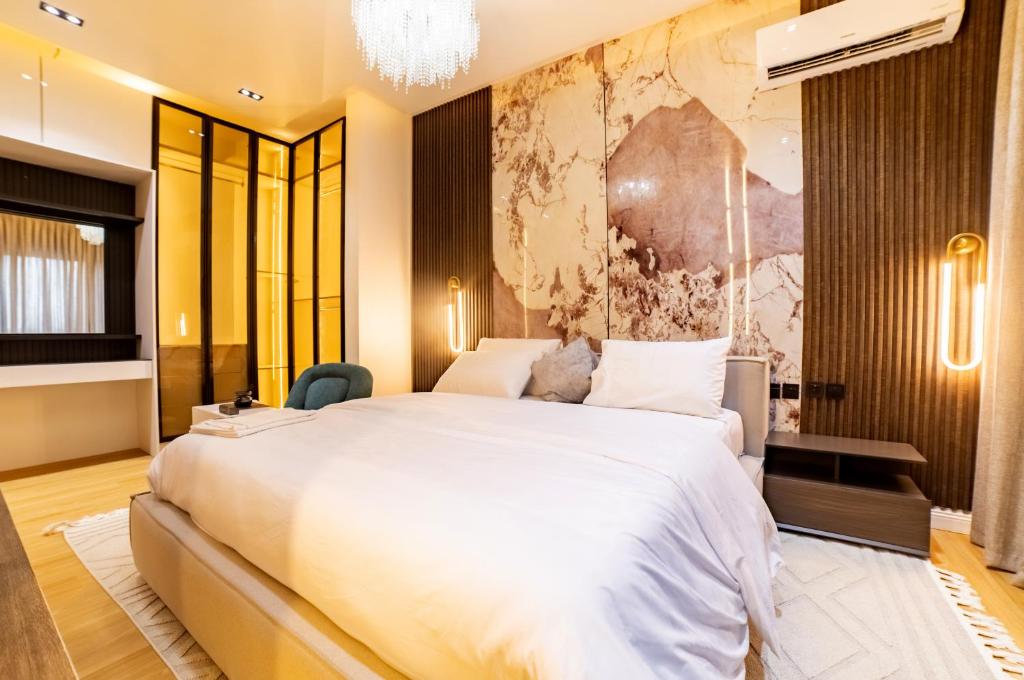 Postel nebo postele na pokoji v ubytování Canar's Suites