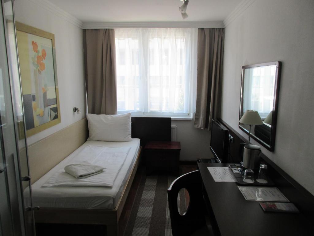 Postel nebo postele na pokoji v ubytování Hotel Attaché l contactless check-in