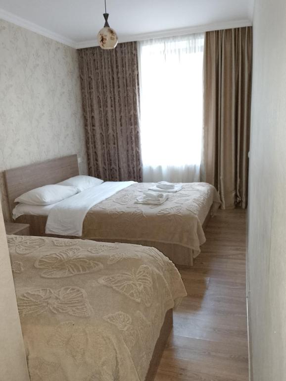 Postel nebo postele na pokoji v ubytování Guest House on V. Pshavela 50