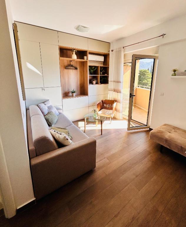 a living room with a couch and a table at Boljevic Apartments in Bečići